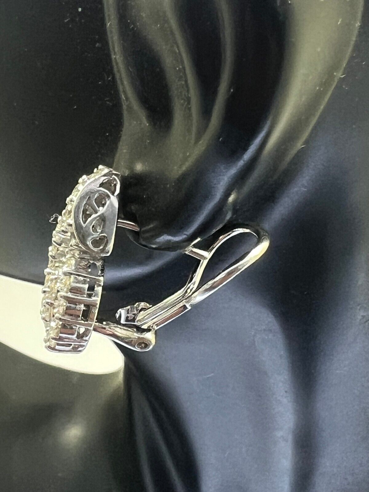 14k White Gold Diamond Channel Swirl Leaver Back Earrings