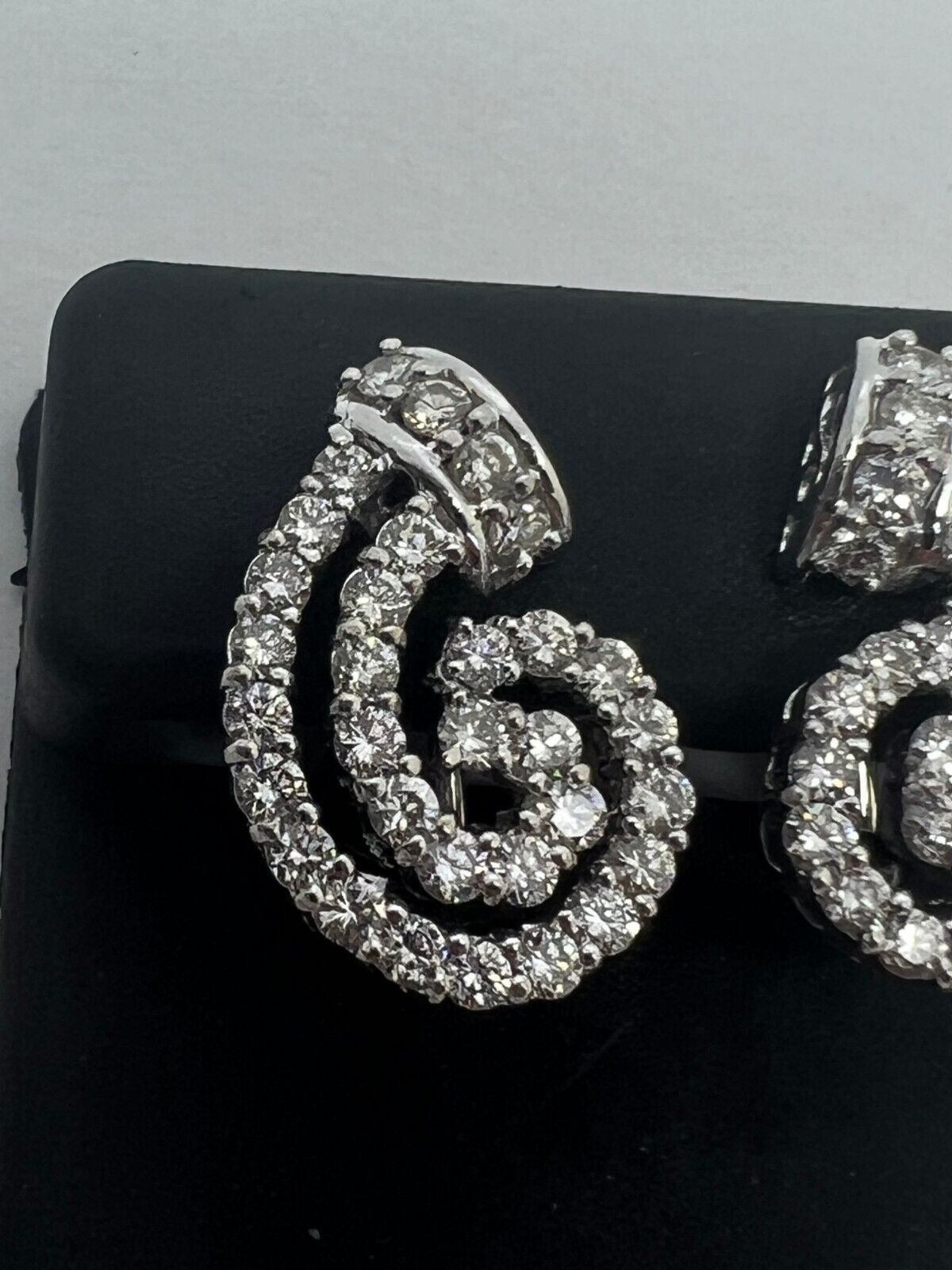 14k White Gold Diamond Channel Swirl Leaver Back Earrings